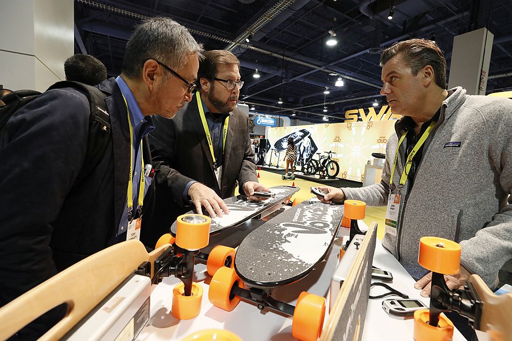Exhibitors and attendees interact at CES 2017